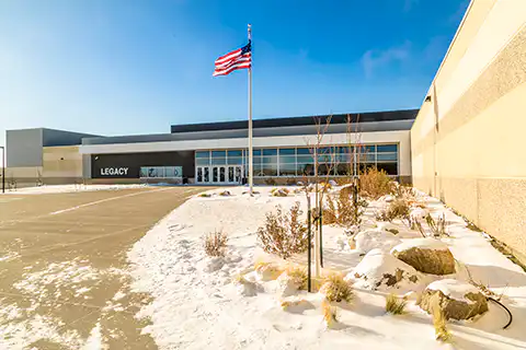 Modern school building with flag