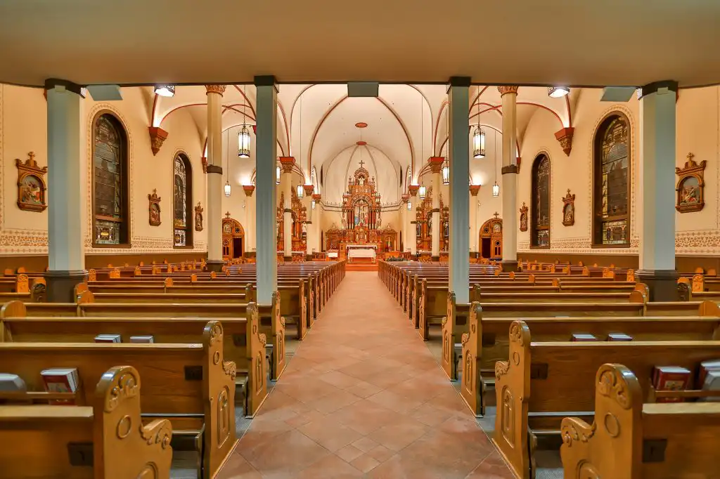 Ornate church interior with statues and innovox speakers