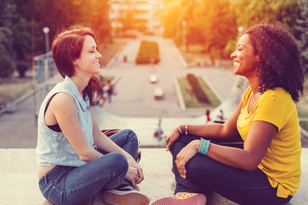 Two Women sitting face-to-face