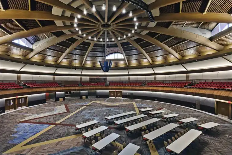 Spacious auditorium with circular ceiling design and innovox speakers suspended Shakopee Mdewakanton Sioux Community Place of Gathering, Shakopee MN