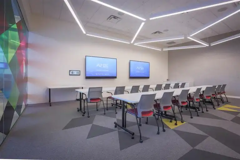 Conference room with two displays and Innovox Audio Flex speakers