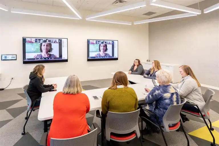 Conference room with two displays and Innovox Audio Flex speakers