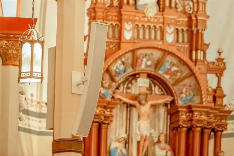 Ornate church interior with statues and innovox speakers