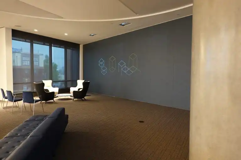 Modern lounge with geometric wall design