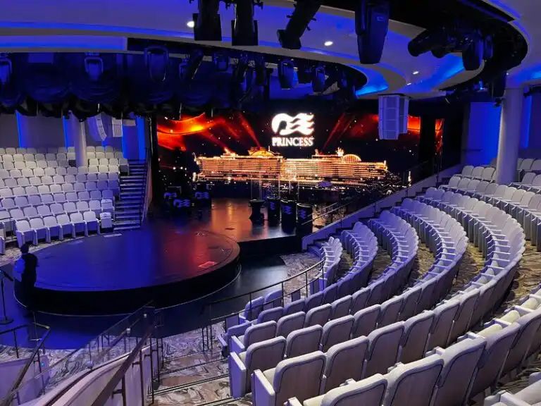 Theater stage on cruise ship with seating arrangement.