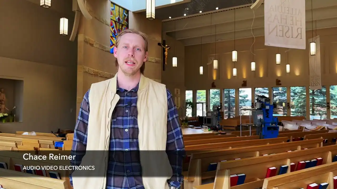 Audio visual integrator stands in church while new sound system from Innovox Audio is installed