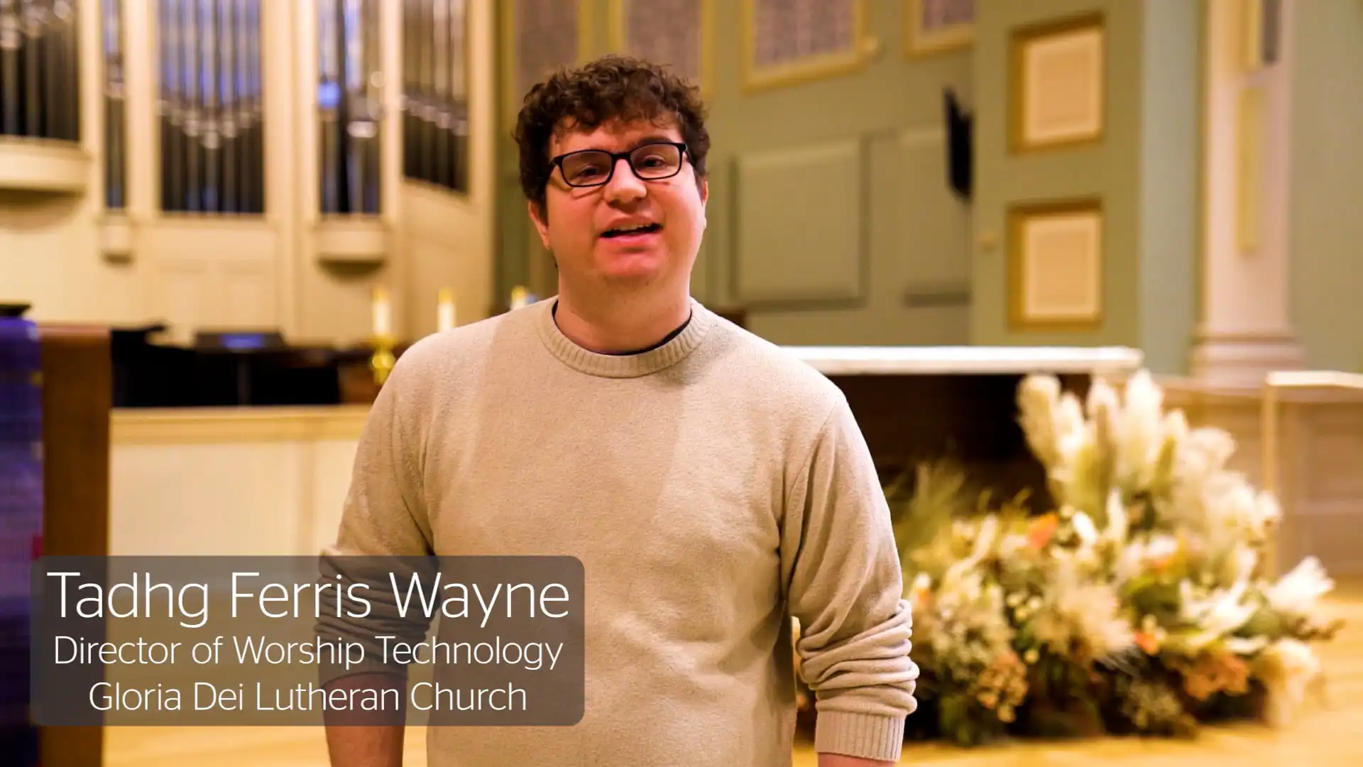 Man speaking in church setting.