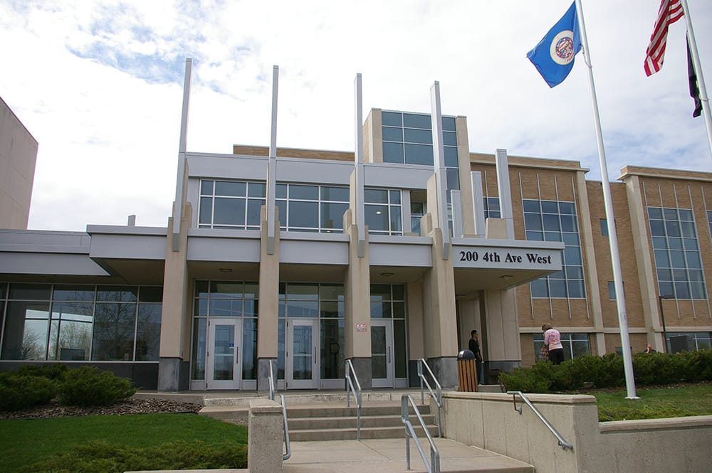 Modern building with flagpoles outside