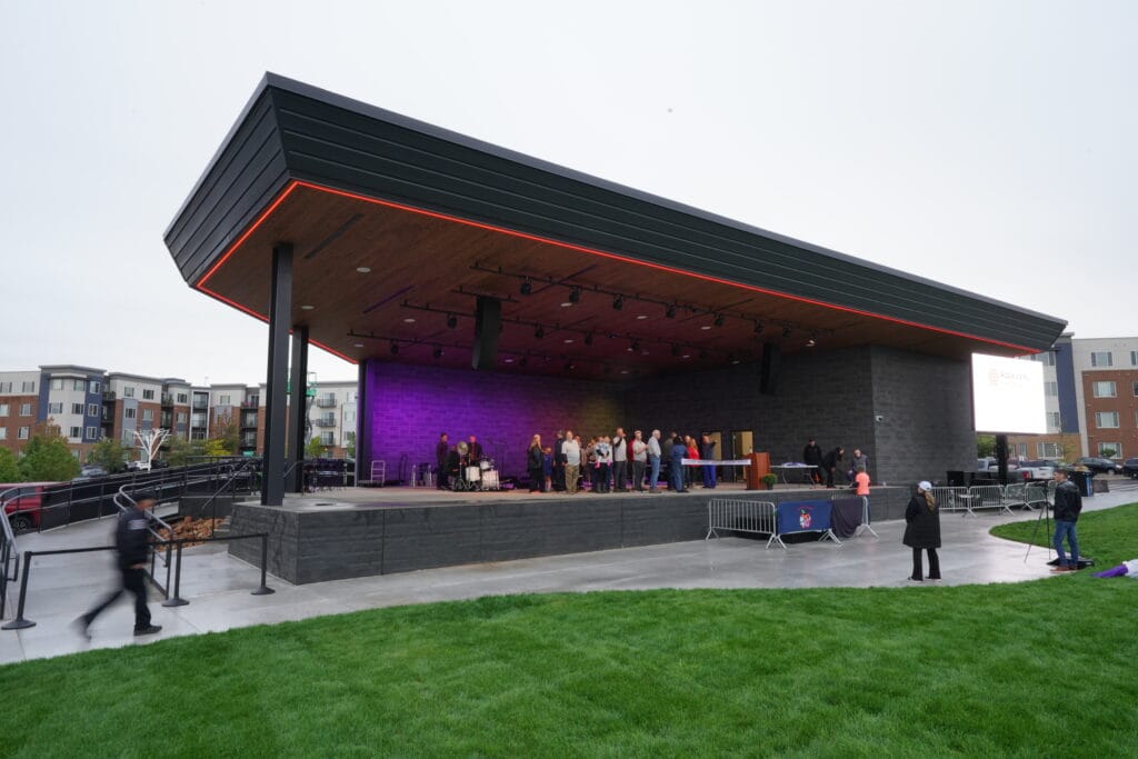 Outdoor stage with people preparing event