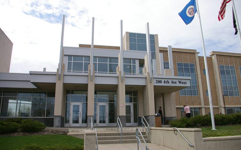 Modern building with flagpoles outside