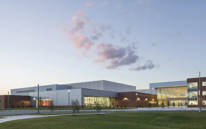 Modern school building at sunset.