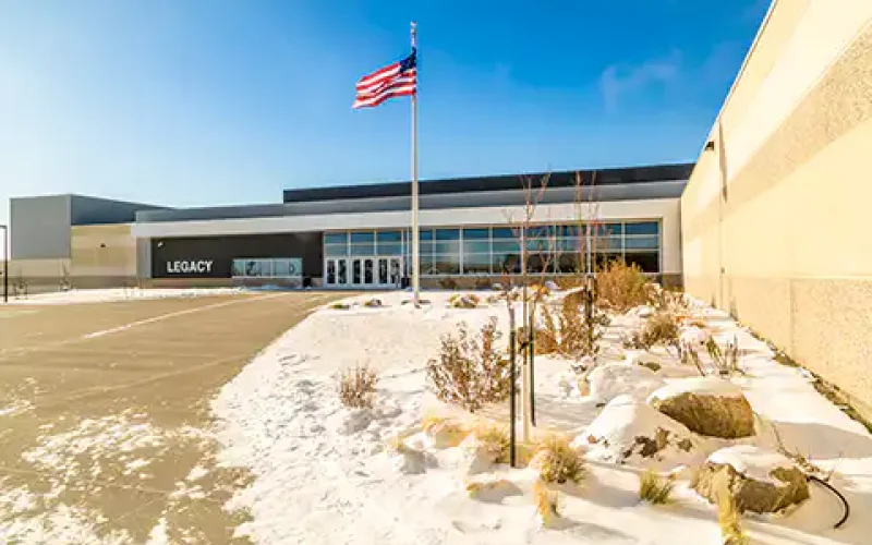 Modern school building with flag