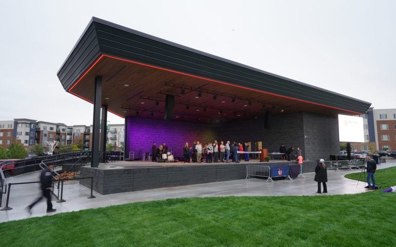 Outdoor stage with people preparing event