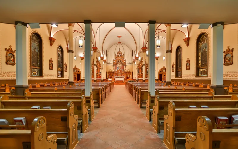 Ornate church interior with statues and innovox speakers