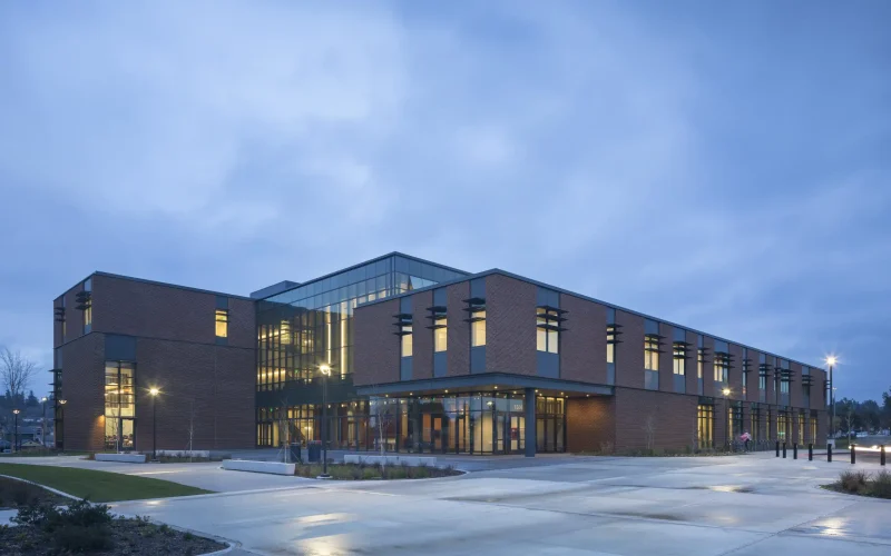Modern brick building at dusk Olympic college