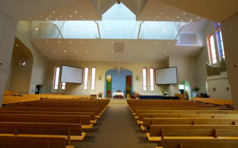 Spacious church interior with wooden pews